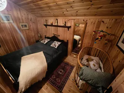 an overhead view of a bedroom in a log cabin at Cozy Cabin Retreat in Trysil, Norway for Families in Trysil