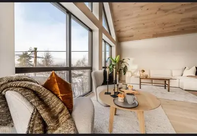 a living room with a couch and a table at New house in the center of Trysil in Trysil
