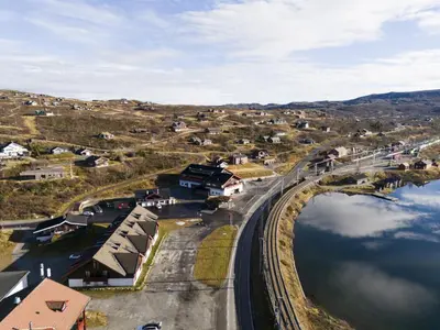 an aerial view of a town with a bridge over a body of water at Alpine Apartment with Parking and Balcony in Ustaoset