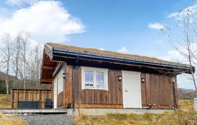 a small wooden house with a grass roof at 2 Bedroom Cozy Home In Straumgjerde in Brunstad