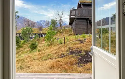 an open window with a view of a house at 2 Bedroom Cozy Home In Straumgjerde in Brunstad