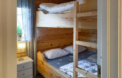 a couple of bunk beds in a room at 3 Bedroom Beautiful Home In Straumgjerde in Brunstad