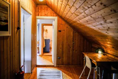a hallway of a house with a wooden ceiling at Leave It All in Venabygd