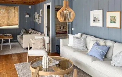 a living room with a couch and a table at Cozy Home In Førde I Hordaland in Erve