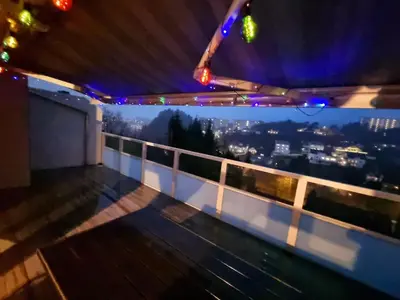 a view from the top of a building at night at Beautiful 2-bedroom apartment in Bergen