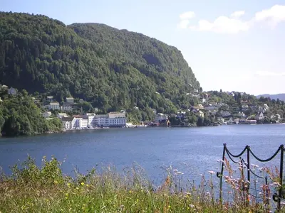 a view of a body of water with a mountain at Cozy house in historical area in Bergen