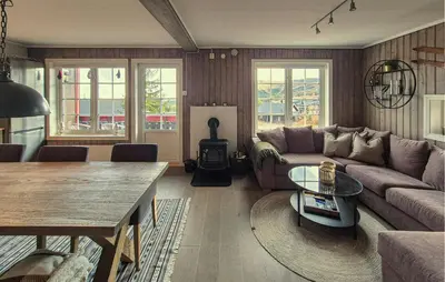 a living room with a couch and a table at Awesome Apartment In Trysil With Sauna in Trysil