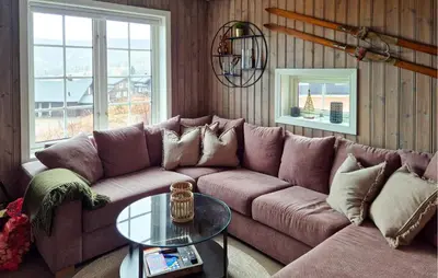 a living room with a couch and a table at Awesome Apartment In Trysil With Sauna in Trysil