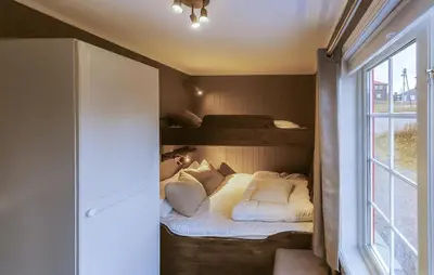 a bedroom with two bunk beds and a window at Awesome Apartment In Trysil With Sauna in Trysil