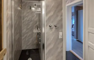 a bathroom with a shower with a glass door at Awesome Apartment In Trysil With Sauna in Trysil