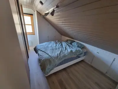 a bed in a small room in a tiny house at Room in Trondheim, Heimdal, Lundåsen - Bus to town every 5 minutes in Trondheim
