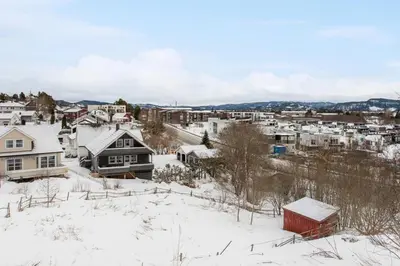 a snow covered city with houses and buildings at Room in Trondheim, Heimdal, Lundåsen - Bus to town every 5 minutes in Trondheim