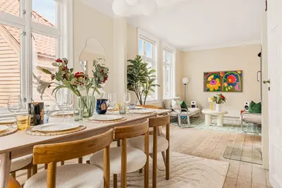 a dining room with a table and chairs at The 1880 Authentic Bergen Dream I 500m to Bryggen in Bergen