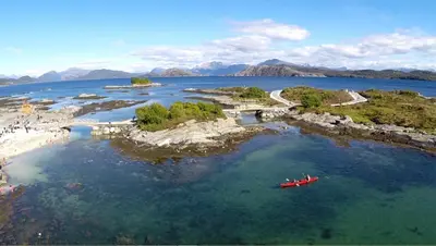 a group of people in a boat in the water at Townhouse with 4 bedrooms near Sørstrand