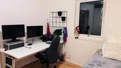 a bedroom with a desk with two computer monitors on it at Townhouse with 4 bedrooms near Sørstrand