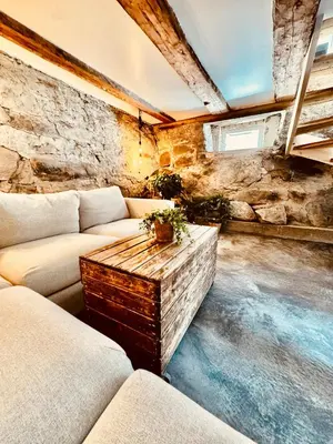 a living room with a couch and a table at Charming in the center of Hamar in Hamar
