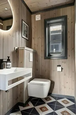 a bathroom with a toilet and a sink and a window at Bo På Norefjell Rett Ved Alpint Og Langrenn in Noresund