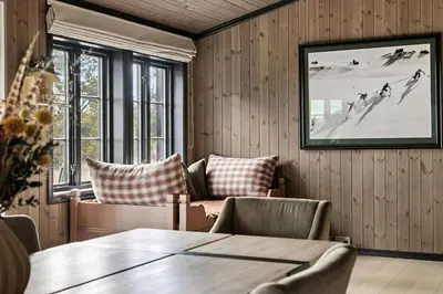 a room with a table and chairs and a picture at Bo På Norefjell Rett Ved Alpint Og Langrenn in Noresund