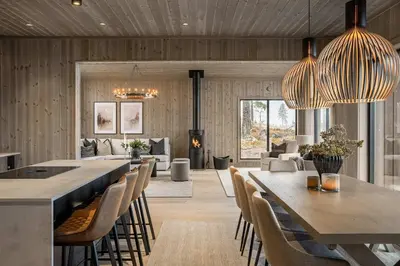 a dining room with a long table and chairs at Trysilfjell hytteområde 2115 by Vacation Trysil in Trysil