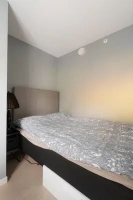 a bed in a small room with a mattress at Central apartement in Kristiansund in Kristiansund