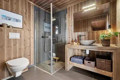 a bathroom with a shower and a toilet and a sink at Large family cabin at Hafjell with ski in-ski out in Hafjell