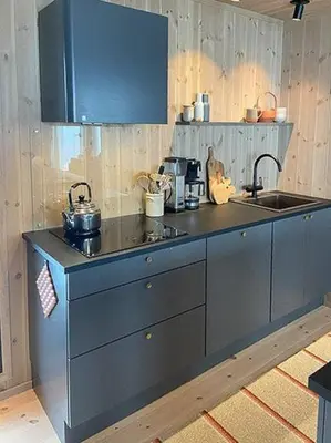 a kitchen with a blue counter and a sink at Mountain Cabinin Valdres in Aurdal