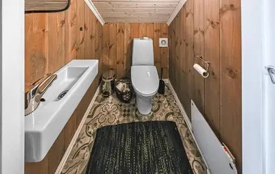 a bathroom with a toilet and a tub and a sink at Nice Home In Rauland With Wifi in Rauland