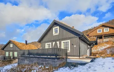 a home in the snow with a house at Nice Home In Rauland With Wifi in Rauland