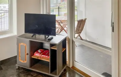 a tv on top of a stand in a room at Awesome Apartment In Eidfjord in Eidfjord