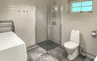 a bathroom with a shower and a toilet at Awesome Apartment In Eidfjord in Eidfjord