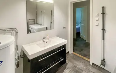 a bathroom with a sink and a mirror at Awesome Apartment In Eidfjord in Eidfjord