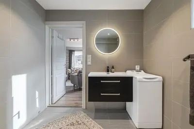 a bathroom with a sink and a mirror at Spacious Hemsedal home with ski slope view in Hemsedal