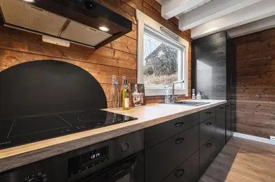 a kitchen with a stove and a sink at Unique 'Stabbur' in Hemsedal, view to skislopes in Hemsedal