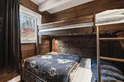 a bedroom with two bunk beds in a cabin at Unique 'Stabbur' in Hemsedal, view to skislopes in Hemsedal