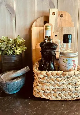 a bottle of wine in a basket on a table at Sunny Cabin With Panoramic Views At Golsfjellet in Tisleidalen