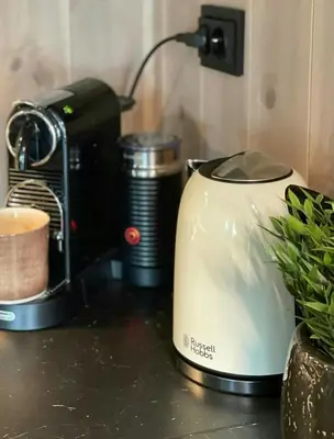 a toaster and a coffee maker on a counter at Sunny Cabin With Panoramic Views At Golsfjellet in Tisleidalen
