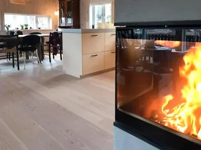 a oven with a fire inside of it in a kitchen at Charming Mountain Cabin In Spectacular Nature in Brunstad