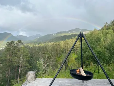 a black hammock with a view of a forest at Modern Cabin Near Maldalsvatnet And Reinsnuten in Sauda