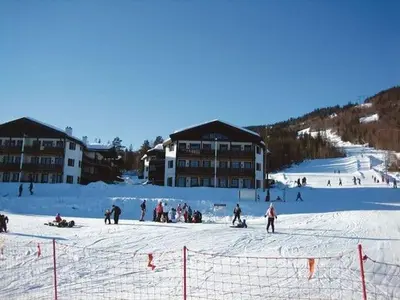 a group of people on a ski slope in the snow at Norefri - Norefjell in Noresund