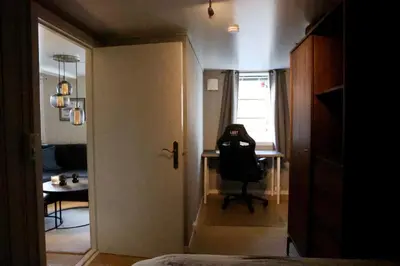 a room with a desk and a chair in a room at Central apartment in Lillehammer in Lillehammer