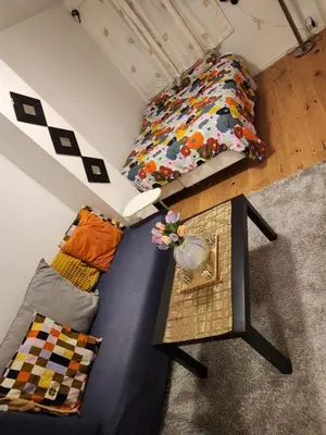 an overhead view of a room with a couch and a bed at Nice Apartment in Sjetnemarka - Free parking and WiFi in Trondheim