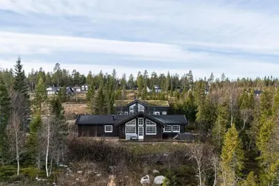 an image of a large house in the woods at Jantelaaven in Trysil