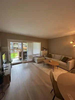 a living room with a couch and a table at Great apartment in Bergen! in Lii
