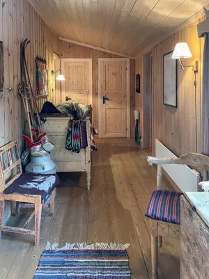 a room with wooden walls and wooden floors and a room with wooden floorshiba sidx at Family Cabin From 1968 At Norefjell in Noresund