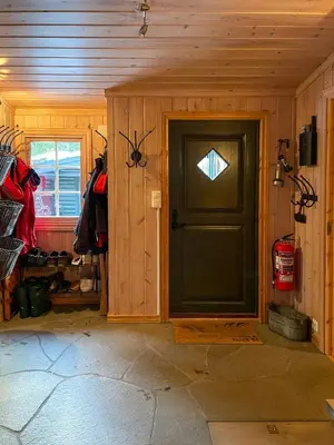 a wooden room with a door and a window at Family Cabin From 1968 At Norefjell in Noresund