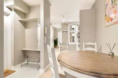 a dining room with a wooden table and chairs at Modern Apartment in Bergen