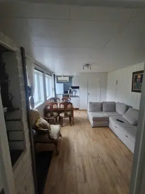 a living room with a couch and a table at Utsikten in Masfjorden