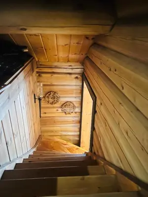 an inside view of a wooden cabin with stairs at Cabin in Kvamskogen in Kvam