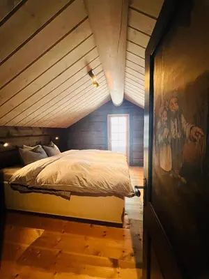 a bedroom with a bed in a attic at Cabin in Kvamskogen in Kvam