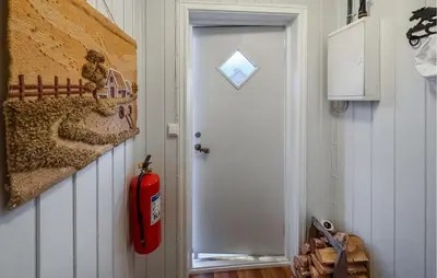 a room with a fire hydrant next to a door at Amazing Apartment In Braskereidfoss With Wifi in Braskereidfoss